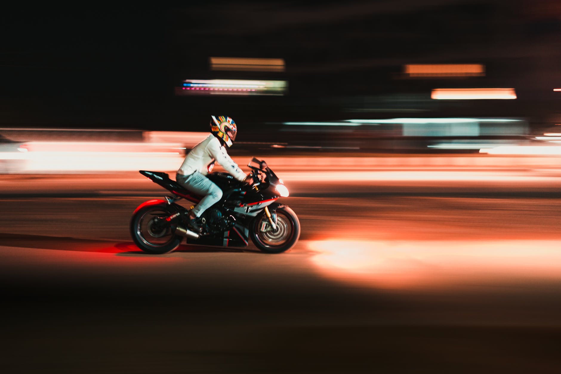 person riding motorcycle in time lapse photography