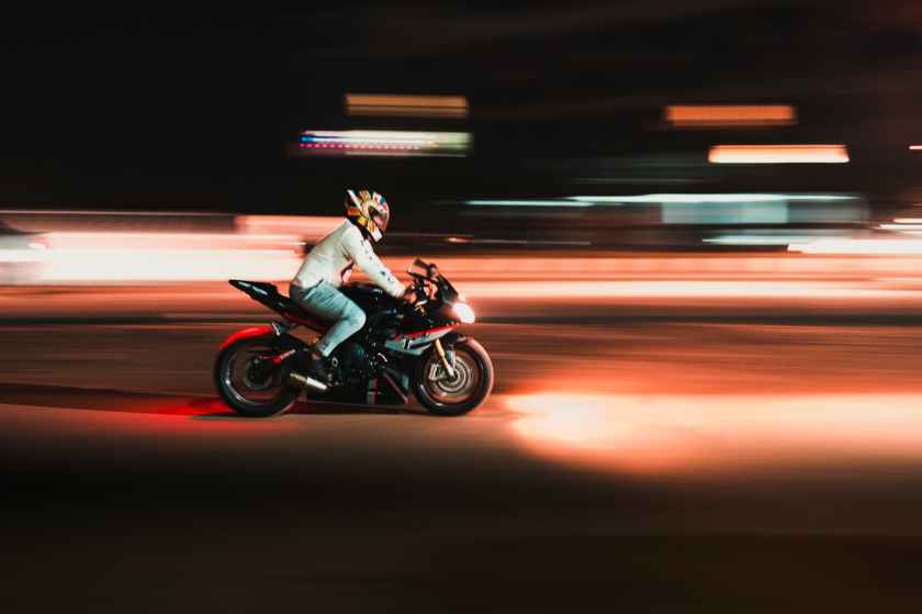 person riding motorcycle in time lapse photography
